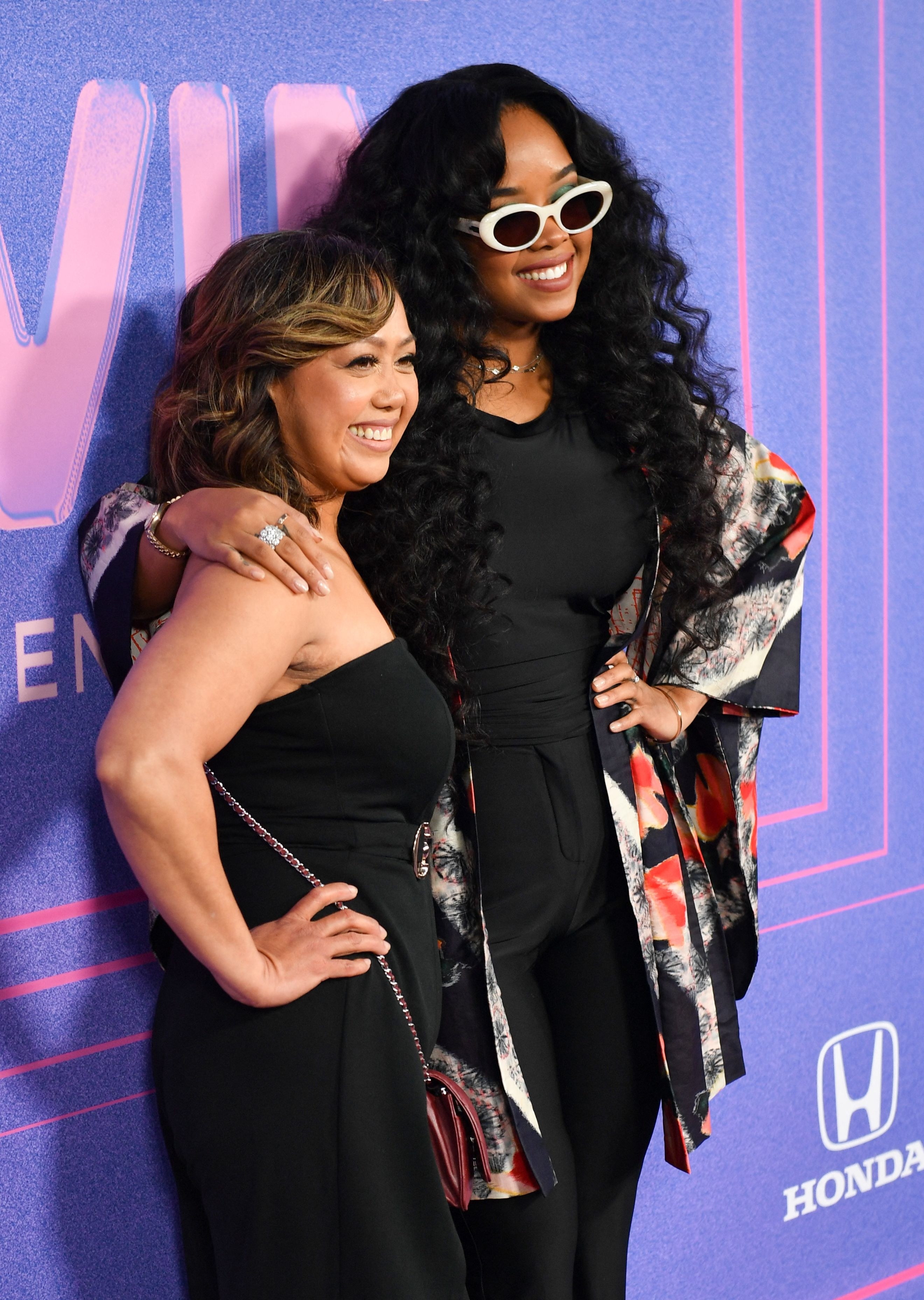 h.e.r singer parents